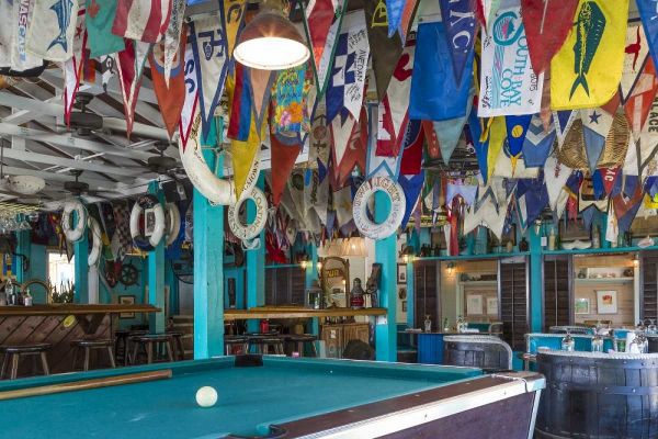Bahamas, Exuma Island Flags on ceiling of bar